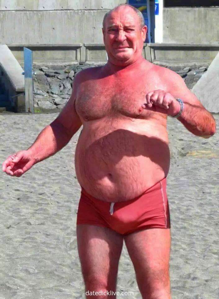 Tanning by the pool nude